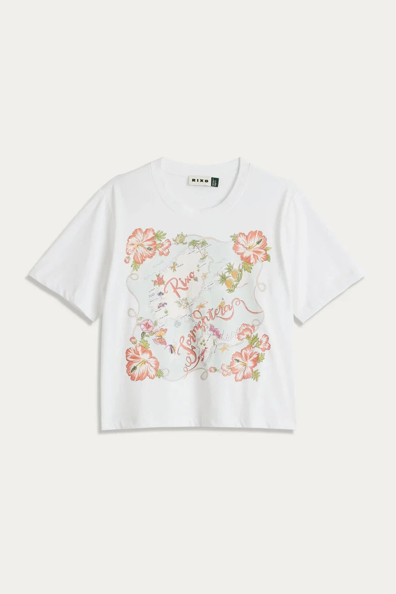 A white short-sleeve crop top t-shirt featuring a large, colorful vintage-style floral map graphic on the front, displayed flat against a light off-white background.