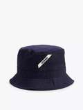 A navy blue bucket hat with a wide brim and a white brand tag embroidered on the front.