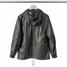 A dark gray faux-leather hooded jacket with elasticized cuffs and a drawstring hem, hanging on a white hanger labeled 'belstaff' against a plain white background.