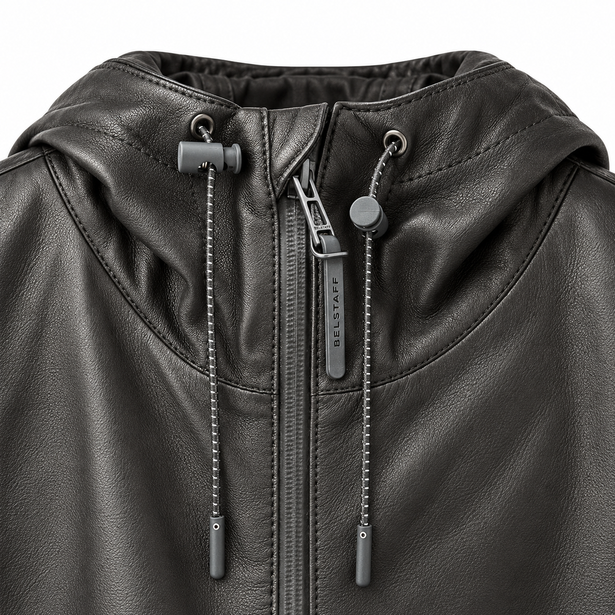 Close-up of a black faux-leather hooded jacket with a front zipper, drawstrings, and a visible BELSTAFF brand tag on the zipper pull.