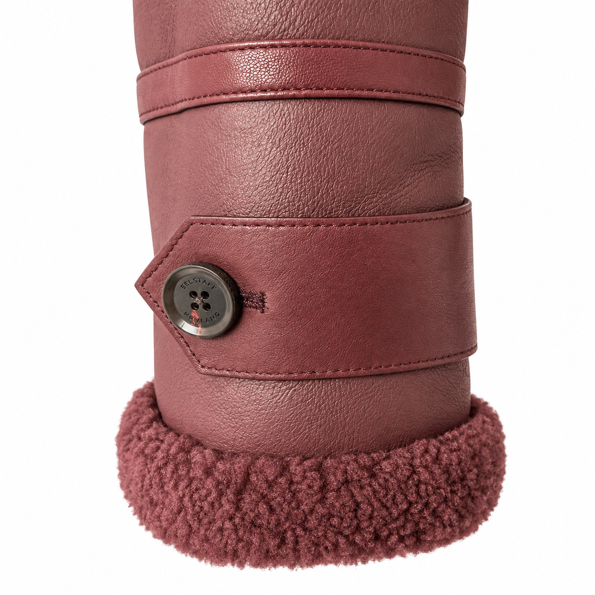 Close-up of a tall boot or shoe in dusty rose-brown faux leather with a matching fuzzy shearling-style cuff and a decorative button closure on the side.