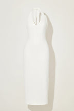 white odd muse dress against a plain background