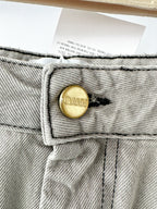 Mini-jupe Ganni grise preppy à ourlet plissé et patch logo