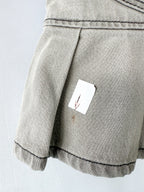 Mini-jupe Ganni grise preppy à ourlet plissé et patch logo