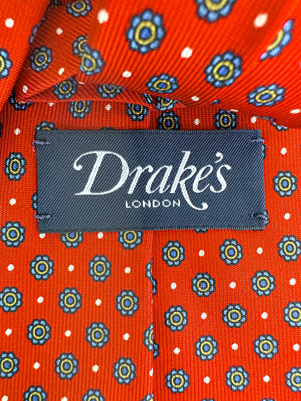 Drake's Seidenkrawatte mit rotem Gänseblümchen-Blumendruck