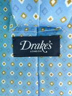 Drake's Hellblaue Seidenkrawatte mit Diamantmuster in Senfgelb