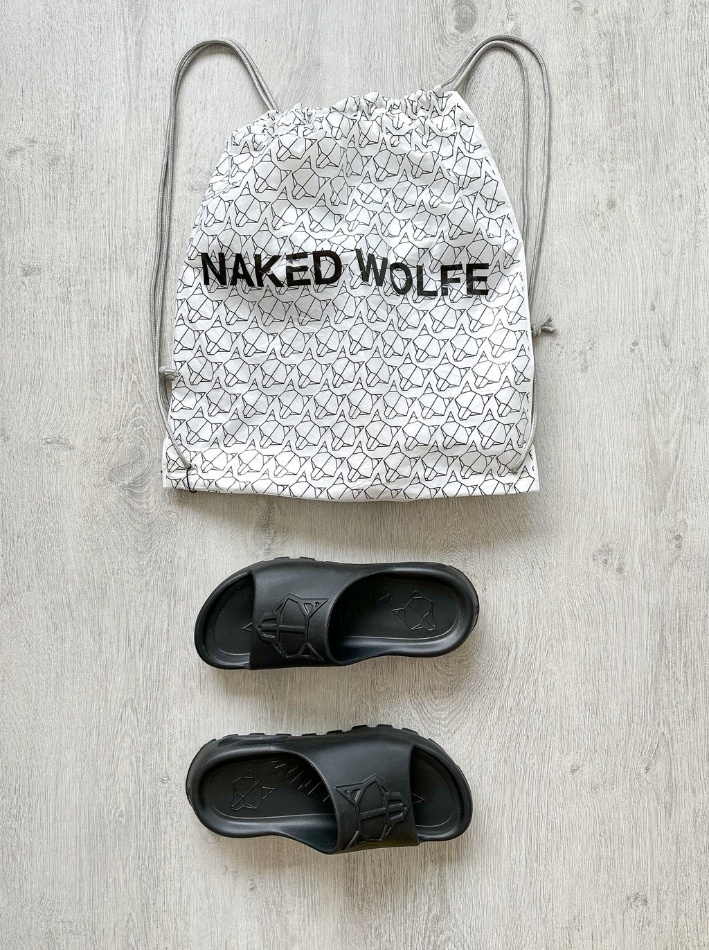 NAKED WOLFE Black Tommy Wold Embossed Waterproof Sandals Slides - House Of Huntington