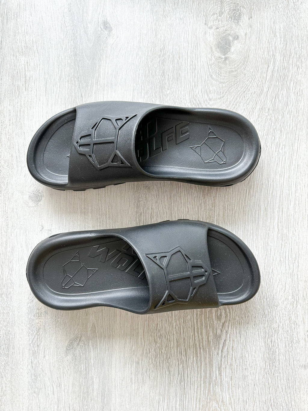 NAKED WOLFE Black Tommy Wold Embossed Waterproof Sandals Slides - House Of Huntington