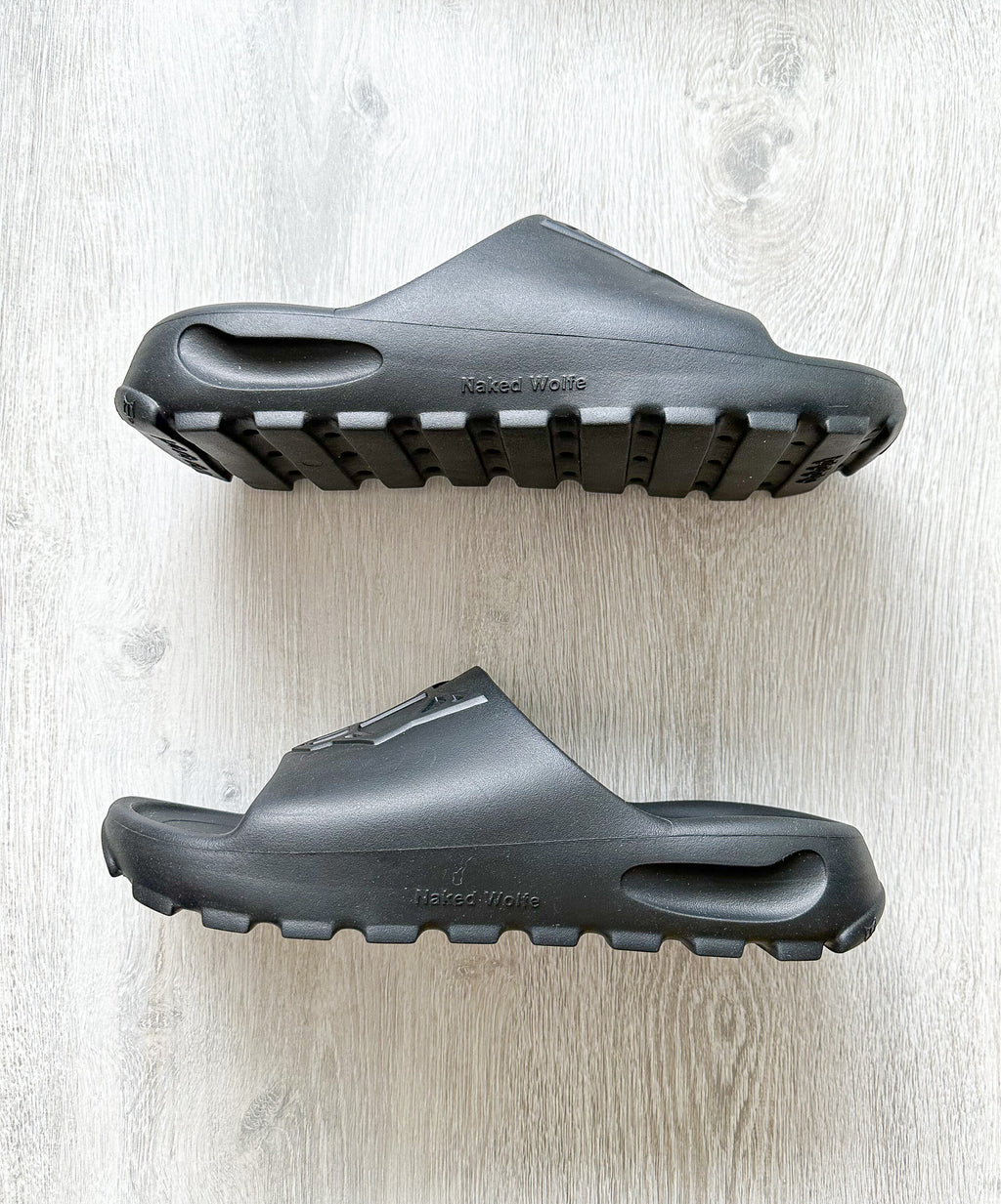 NAKED WOLFE Black Tommy Wold Embossed Waterproof Sandals Slides - House Of Huntington