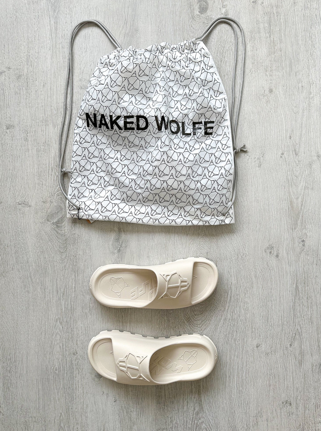 NAKED WOLFE Tommy Stone Cream Waterproof Wolf Embossed Sandals Slide - House Of Huntington