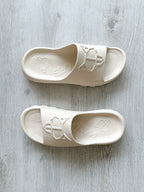NAKED WOLFE Tommy Stone Cream Waterproof Wolf Embossed Sandals Slide - House Of Huntington