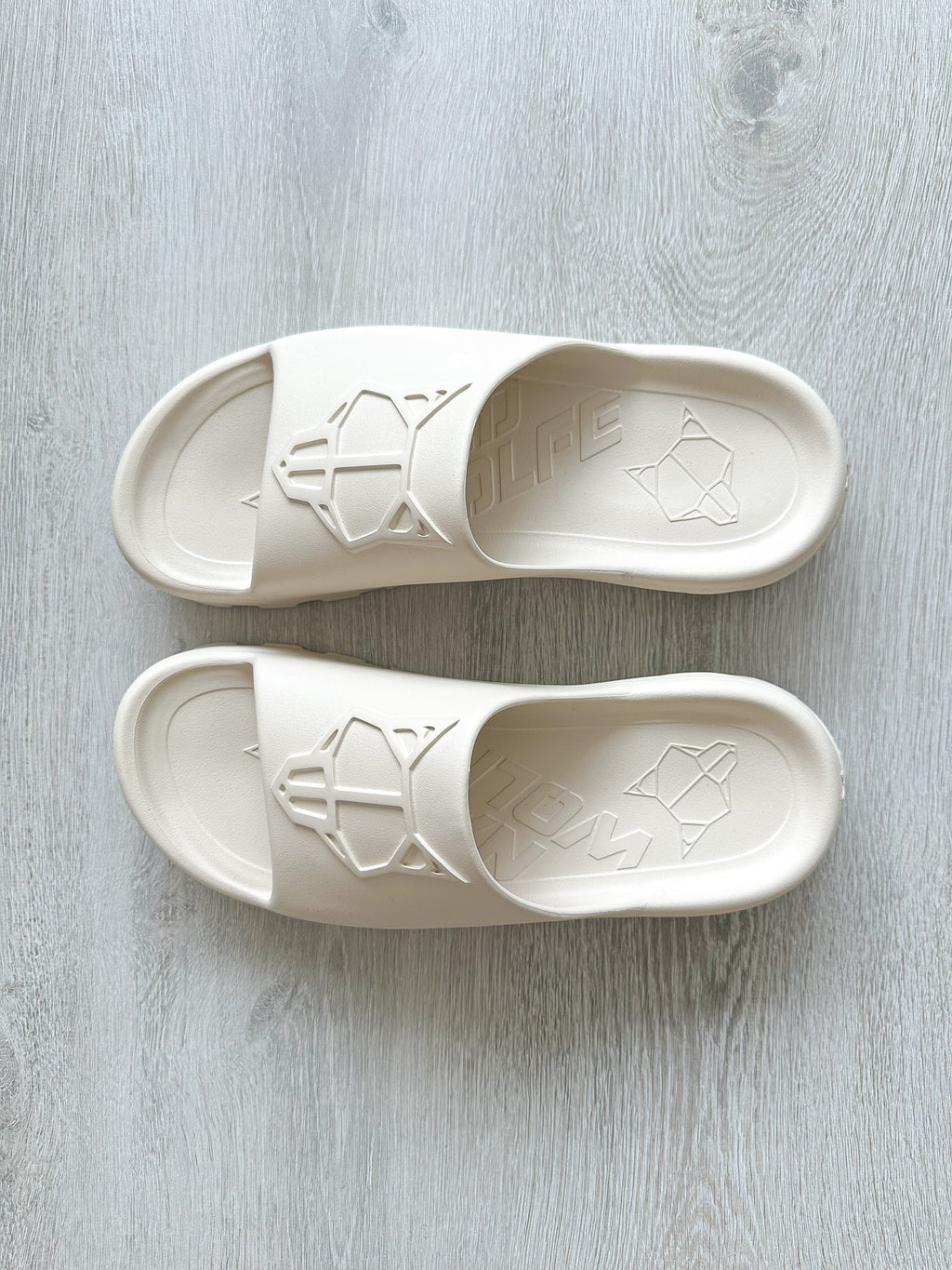 NAKED WOLFE Tommy Stone Cream Waterproof Wolf Embossed Sandals Slide - House Of Huntington