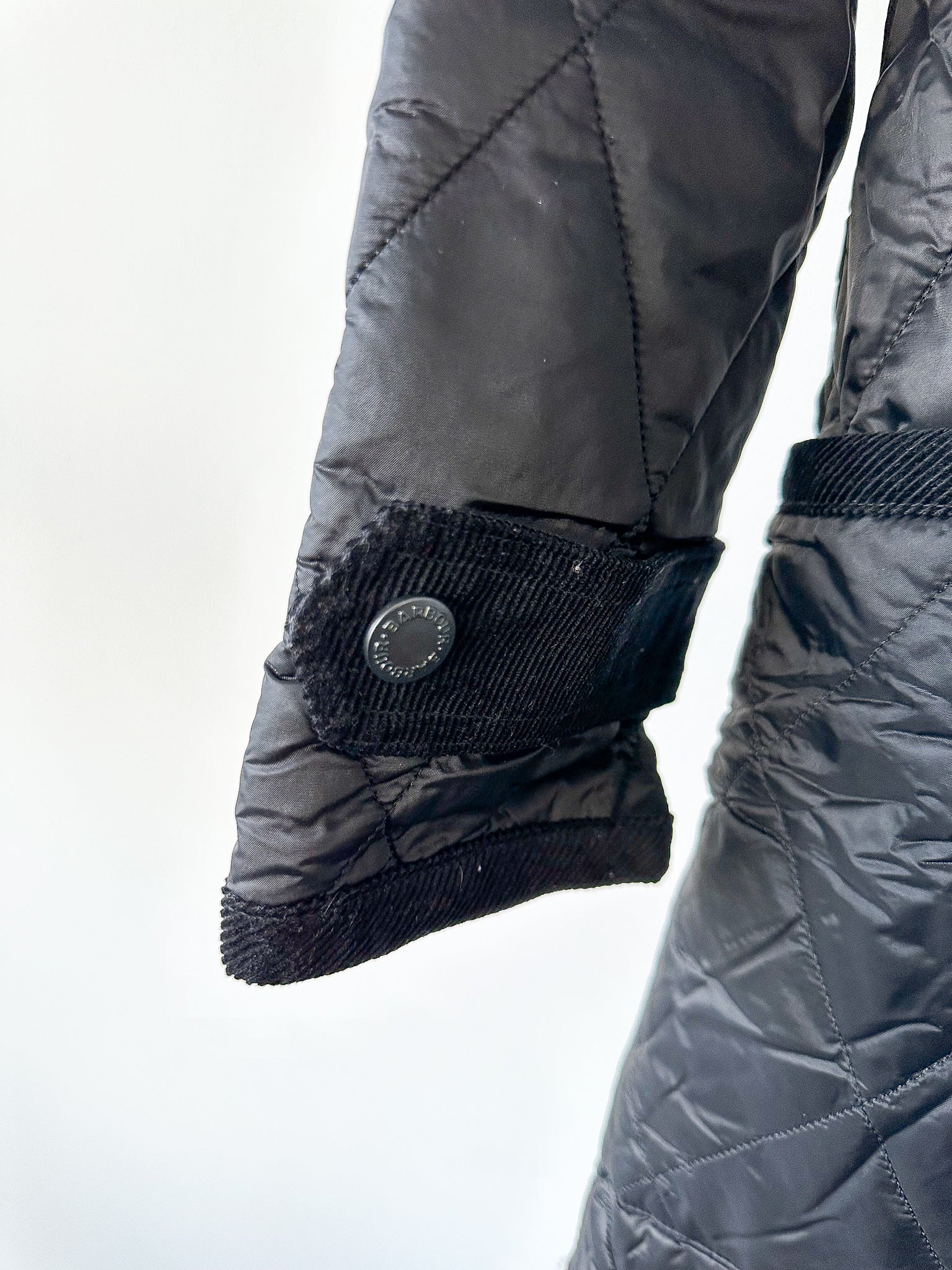 House Of Hackney – Schwarzer, gesteppter Mantel mit Blumenfutter