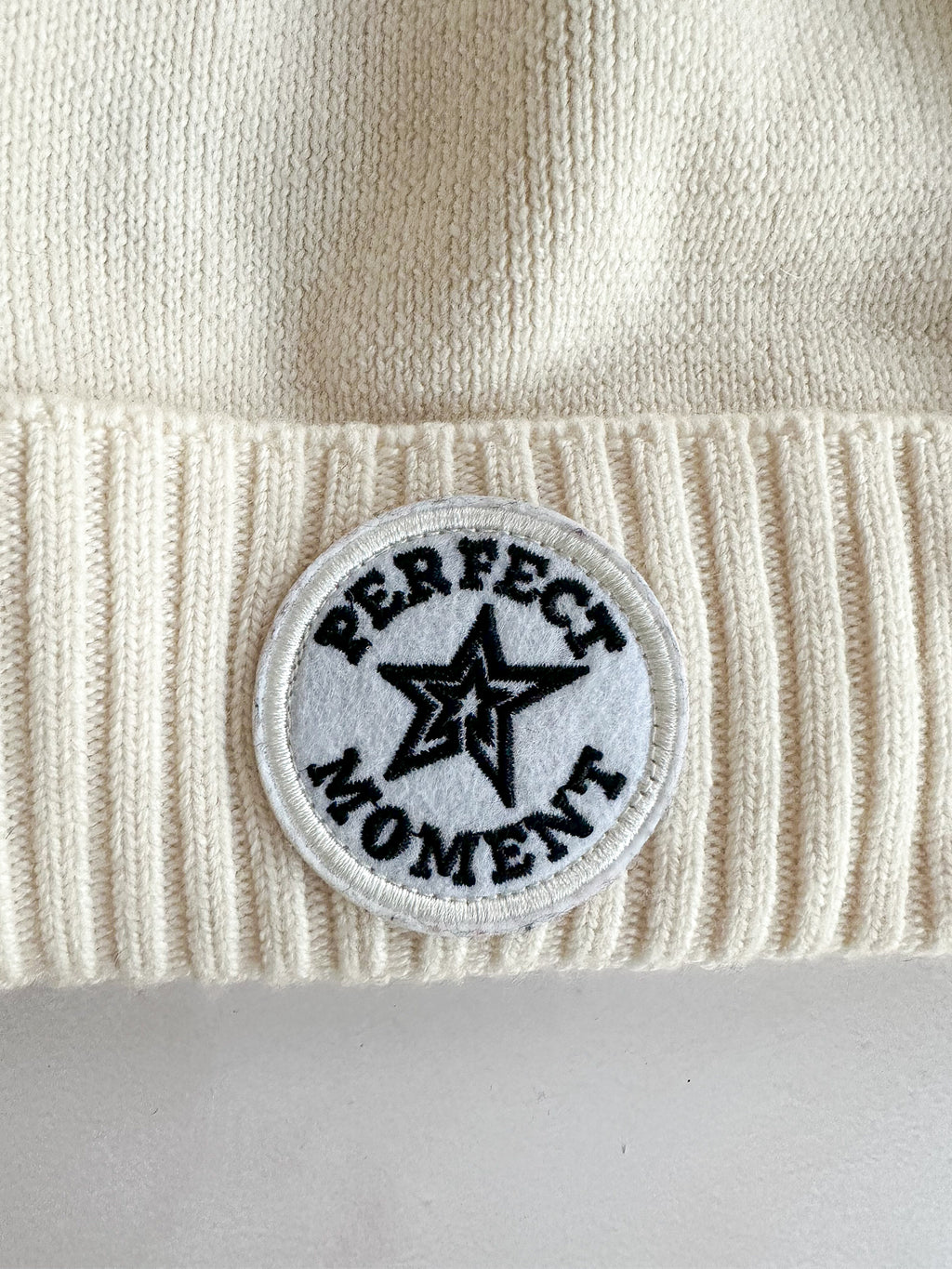 Perfect Moment Patch Ii Pompom Embellished Appliquéd Wool Beanie