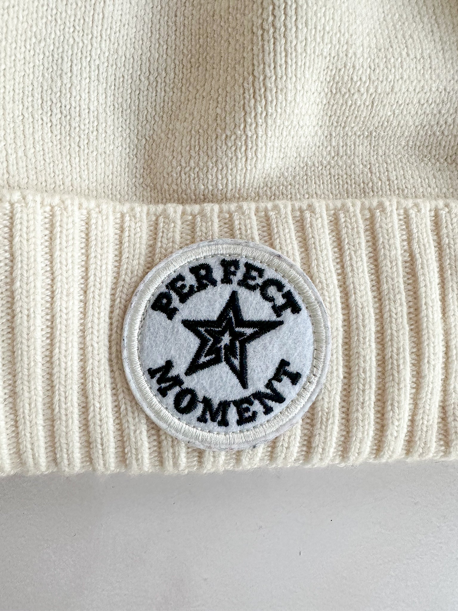 Perfect Moment Patch Ii Pompom Embellished Appliquéd Wool Beanie