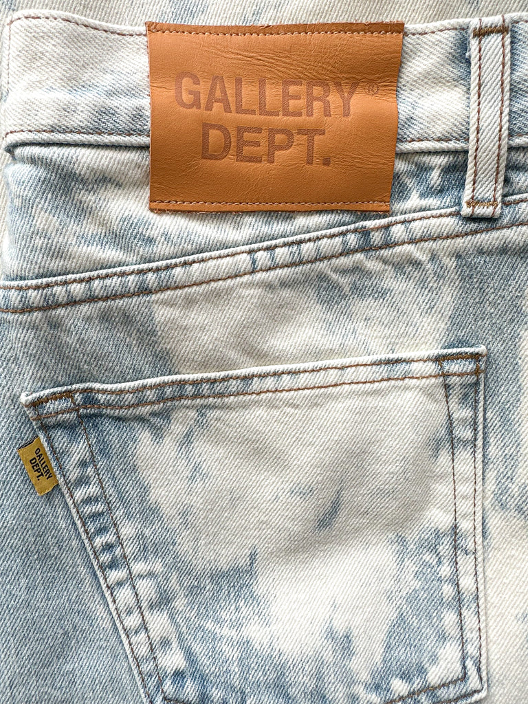Close-up of a denim garment with a 'Gallery Dept.' label.