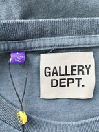 Label on a garment with 'GALLERY DEPT.' text and a purple tag.