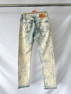 Gallery Dept Levi 501 idstressed white jeans on a hanger against a white background
