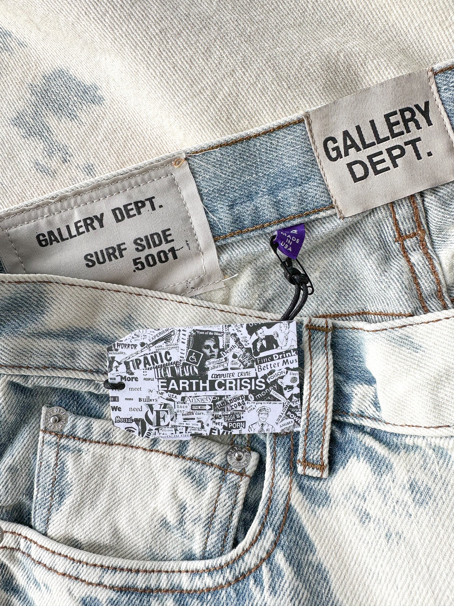 Close-up of denim fabric with 'Gallery Dept.' and 'Surf Side 5001' labels.