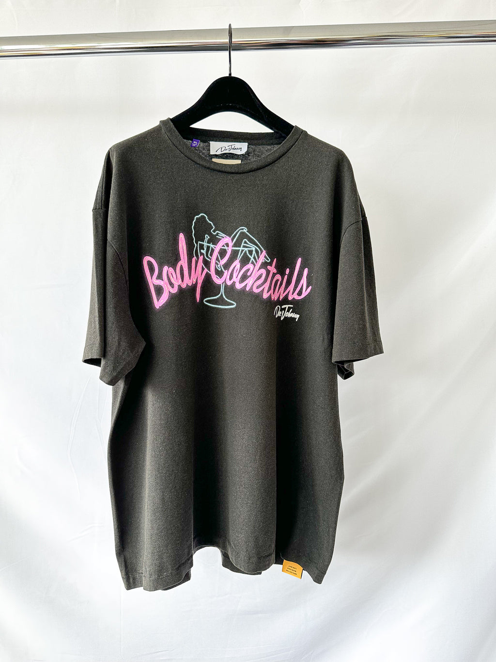 Gallery dept Gray t-shirt with pink and white text on a hanger against a white background
