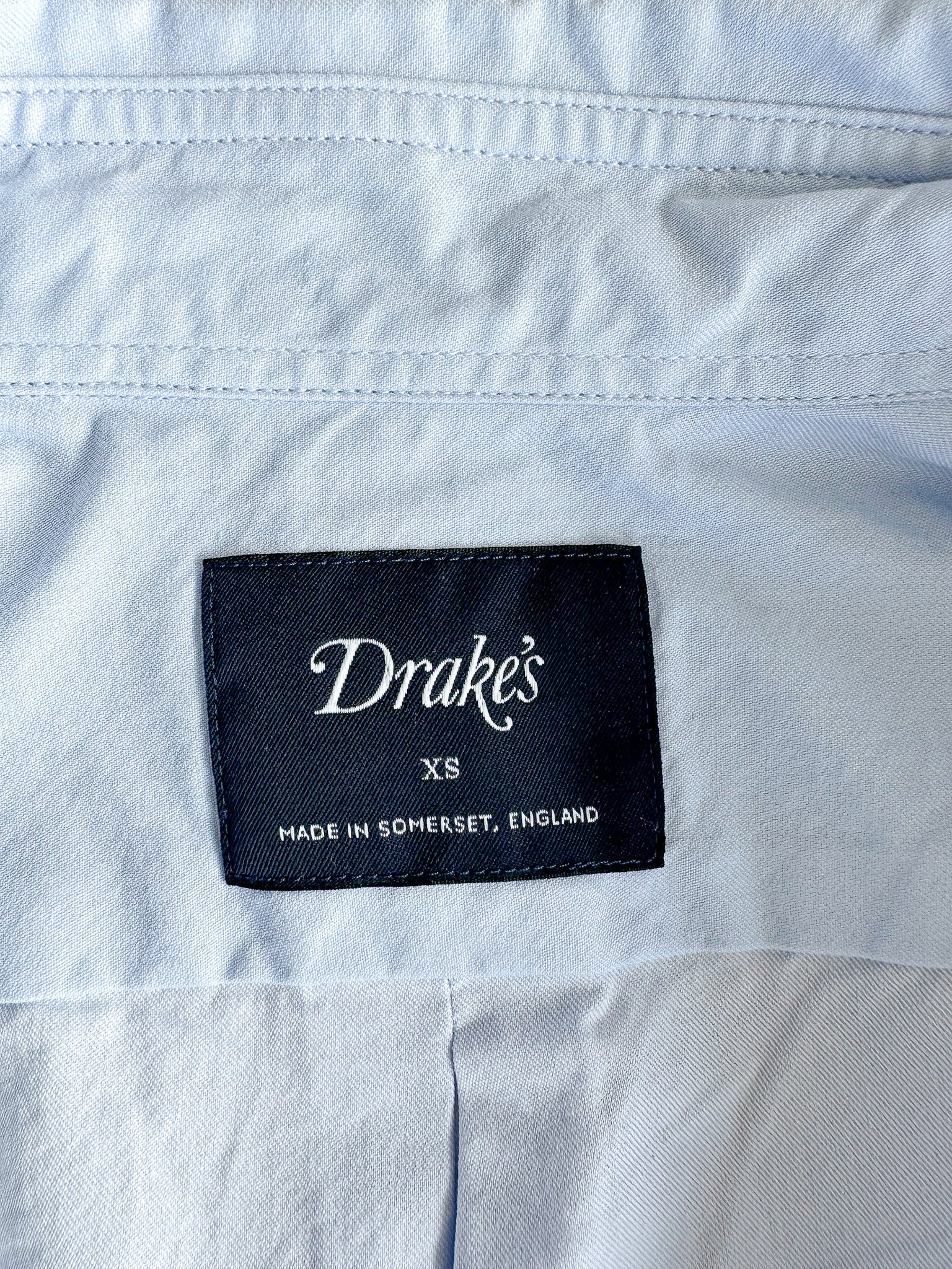 Drake's label on a white shirt with 'Made in Somerset, England' text
