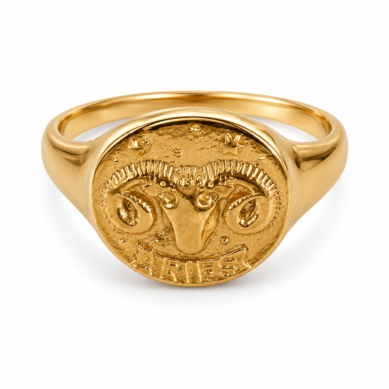 A gold signet ring featuring an engraved ram's head and the word 'Aries' on the oval face, set against a plain white background.