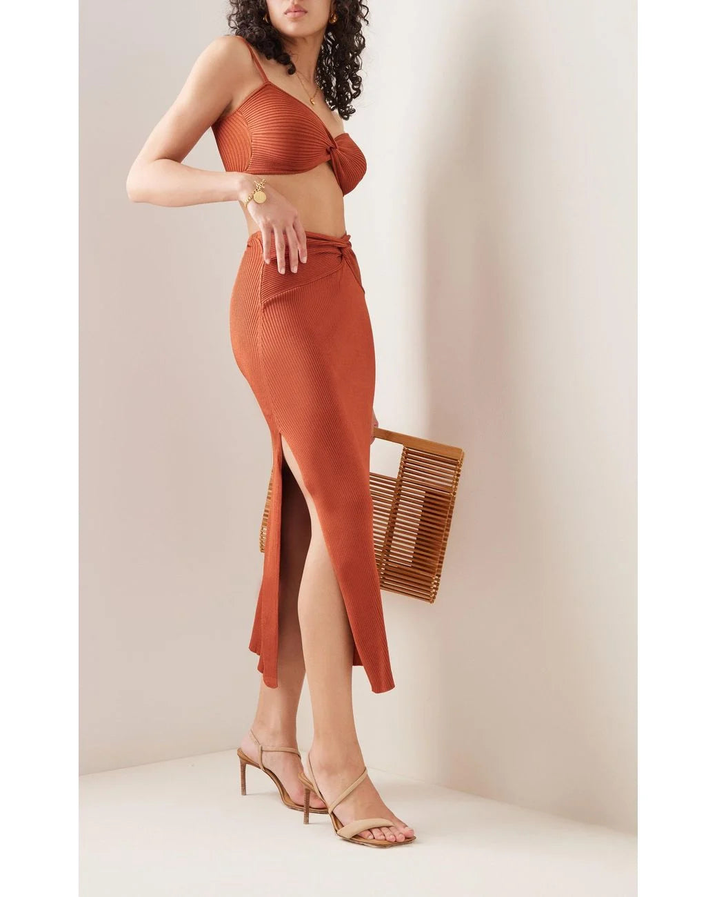 Cult Gaia Kana Ribbed Knit Twist Detail Slit Skirt in Amber - House Of Huntington